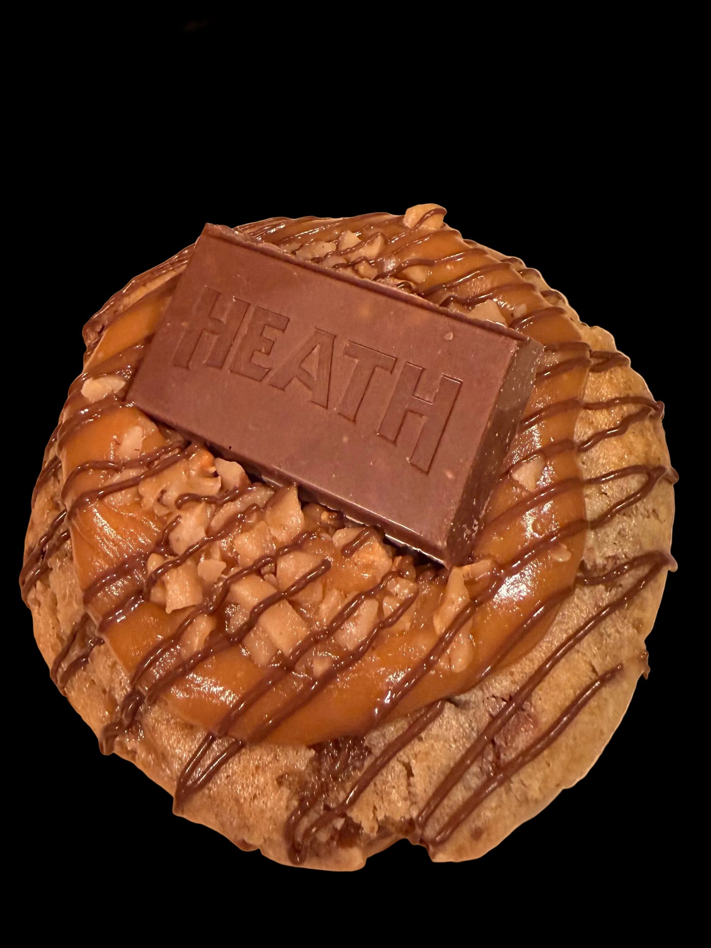 Stuffed with heath candy pieces, topped with caramel, heath candy pieces and chocolate drizzle. 